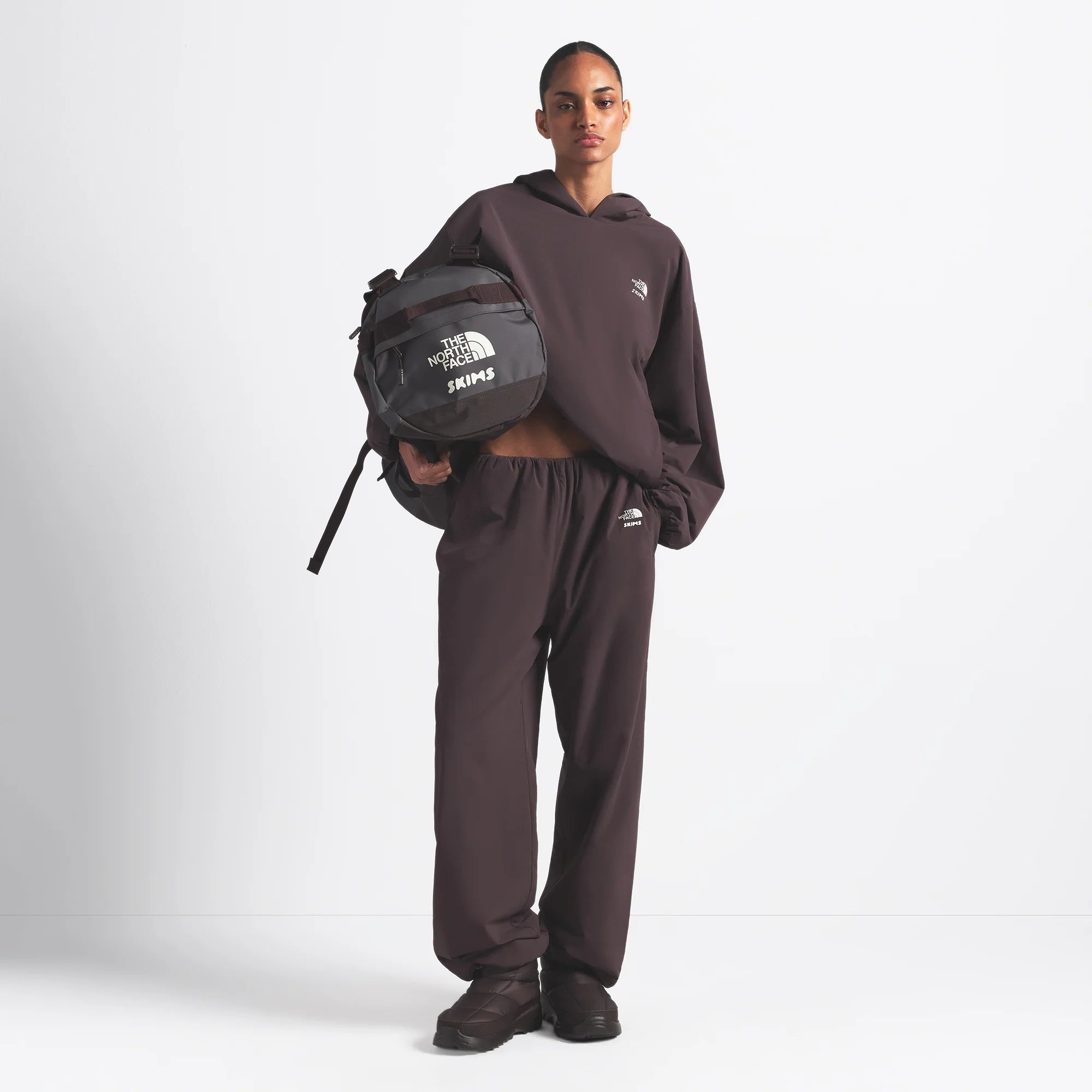 THE NORTH FACE X SKIMS SMALL BASE CAMP DUFFLE BAG | PHOENIX