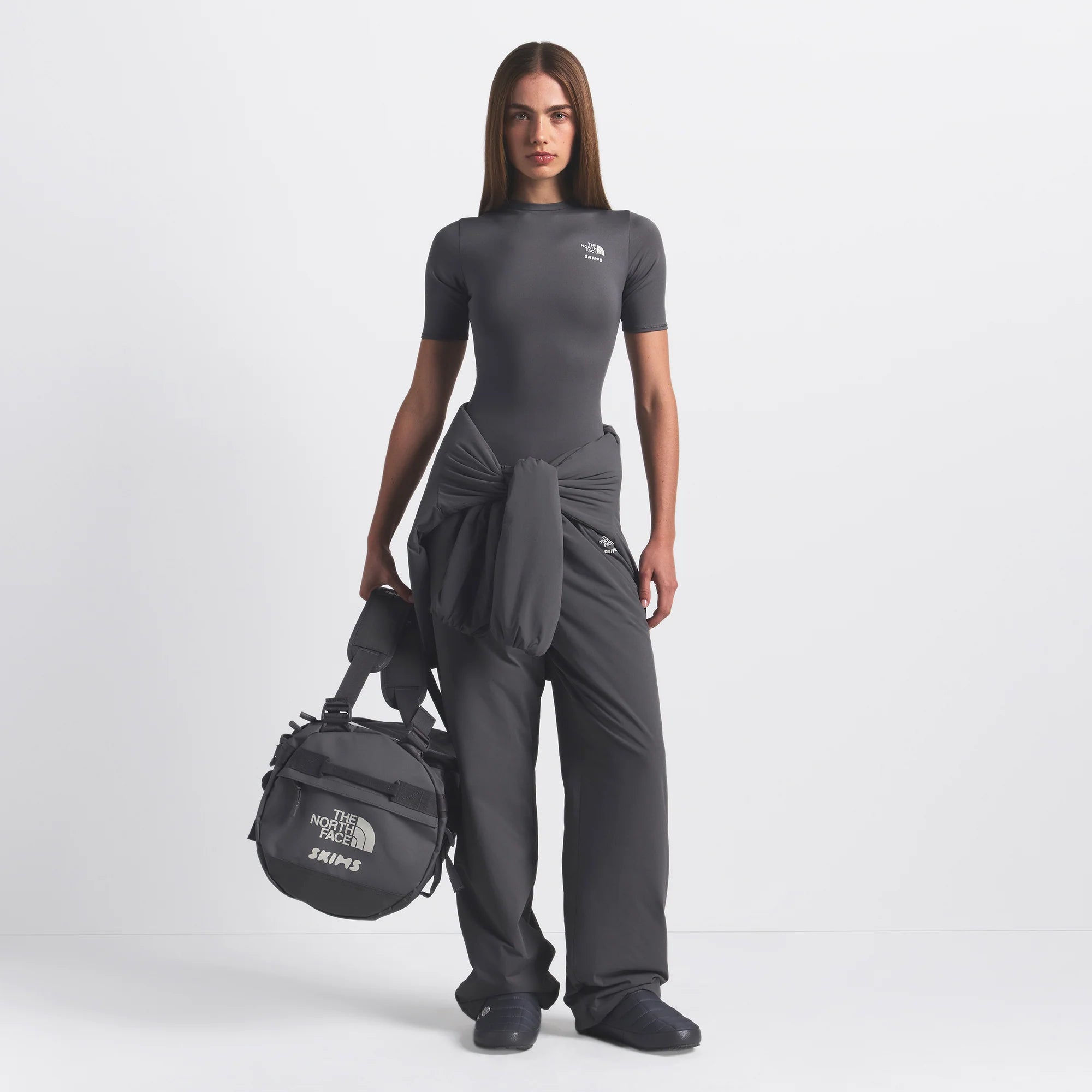 THE NORTH FACE X SKIMS SMALL BASE CAMP DUFFLE BAG | GUNMETAL