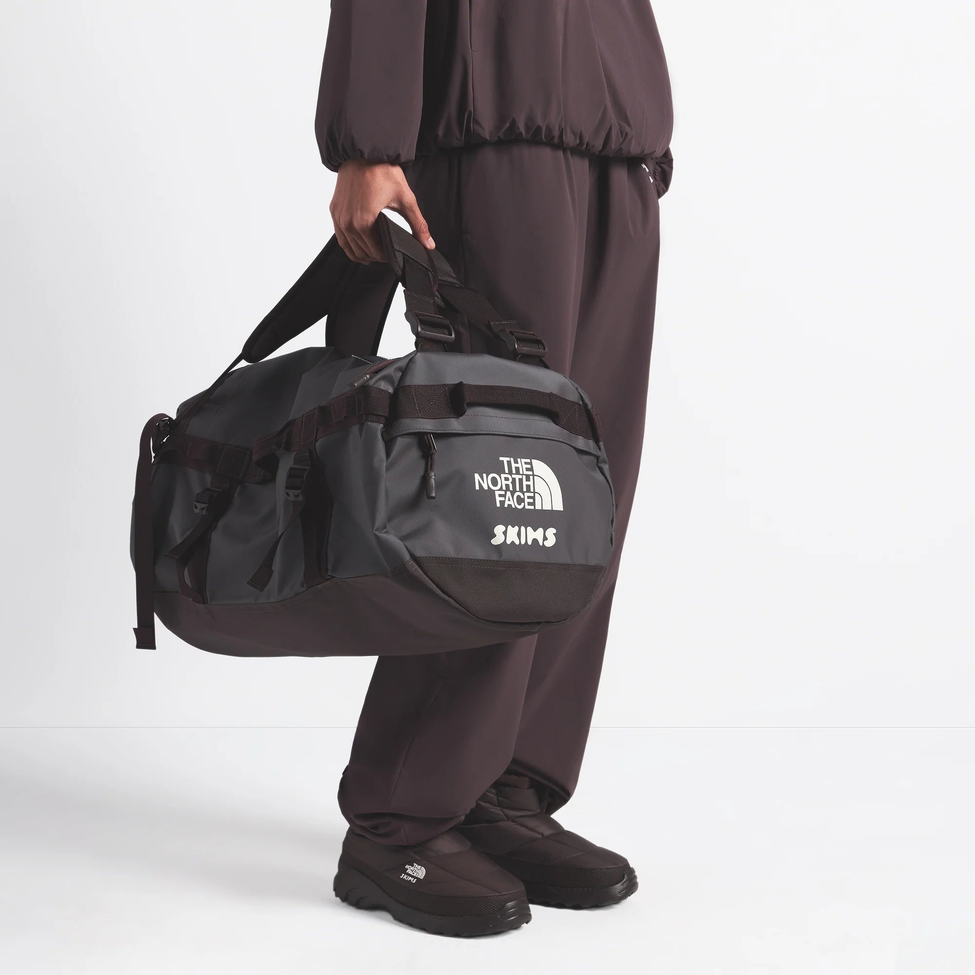THE NORTH FACE X SKIMS SMALL BASE CAMP DUFFLE BAG | PHOENIX